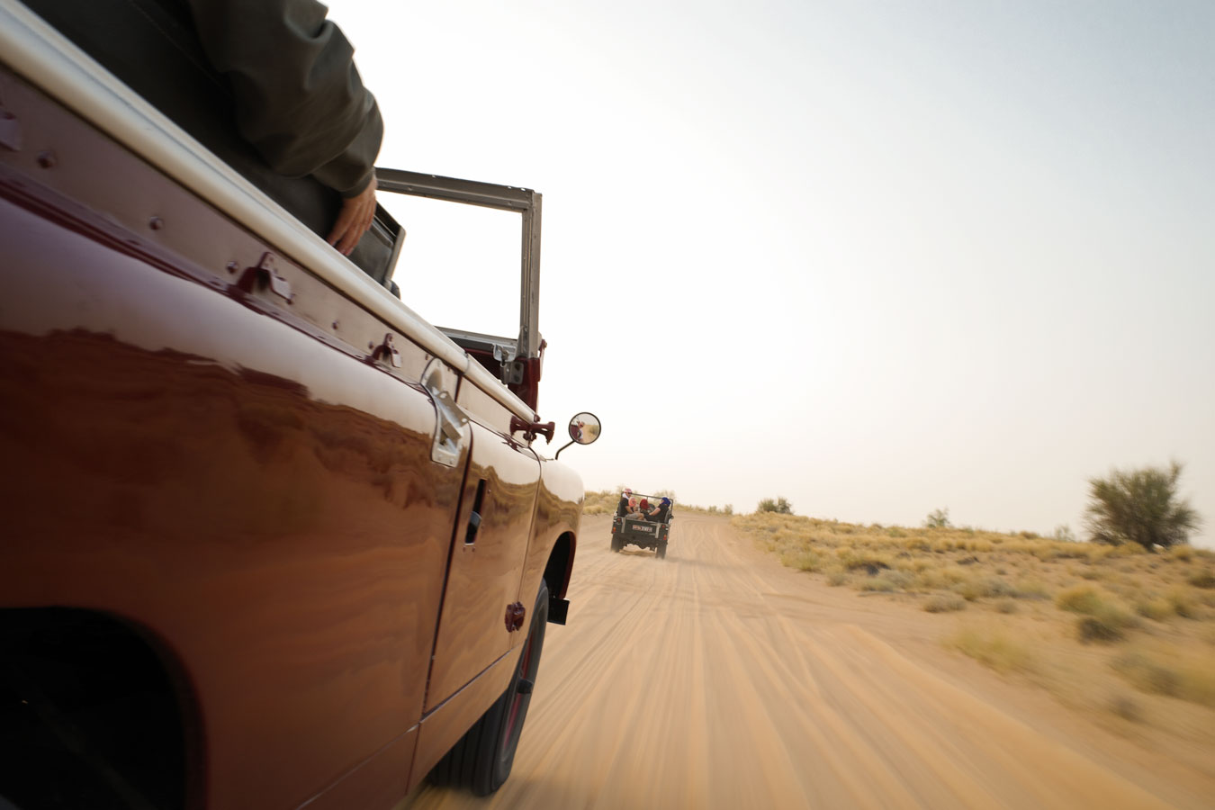 Red Land Rover in the Dubai desert